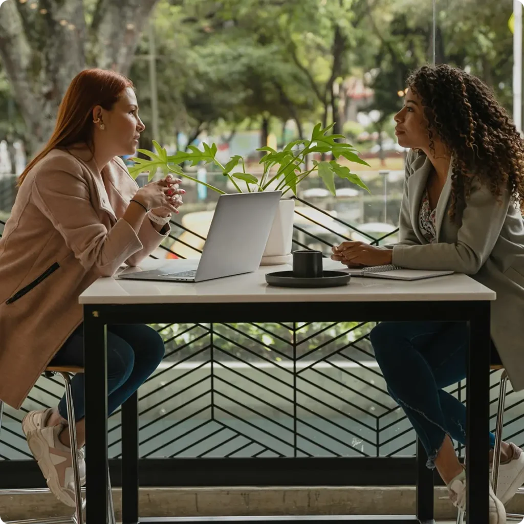 Two women seated at a table