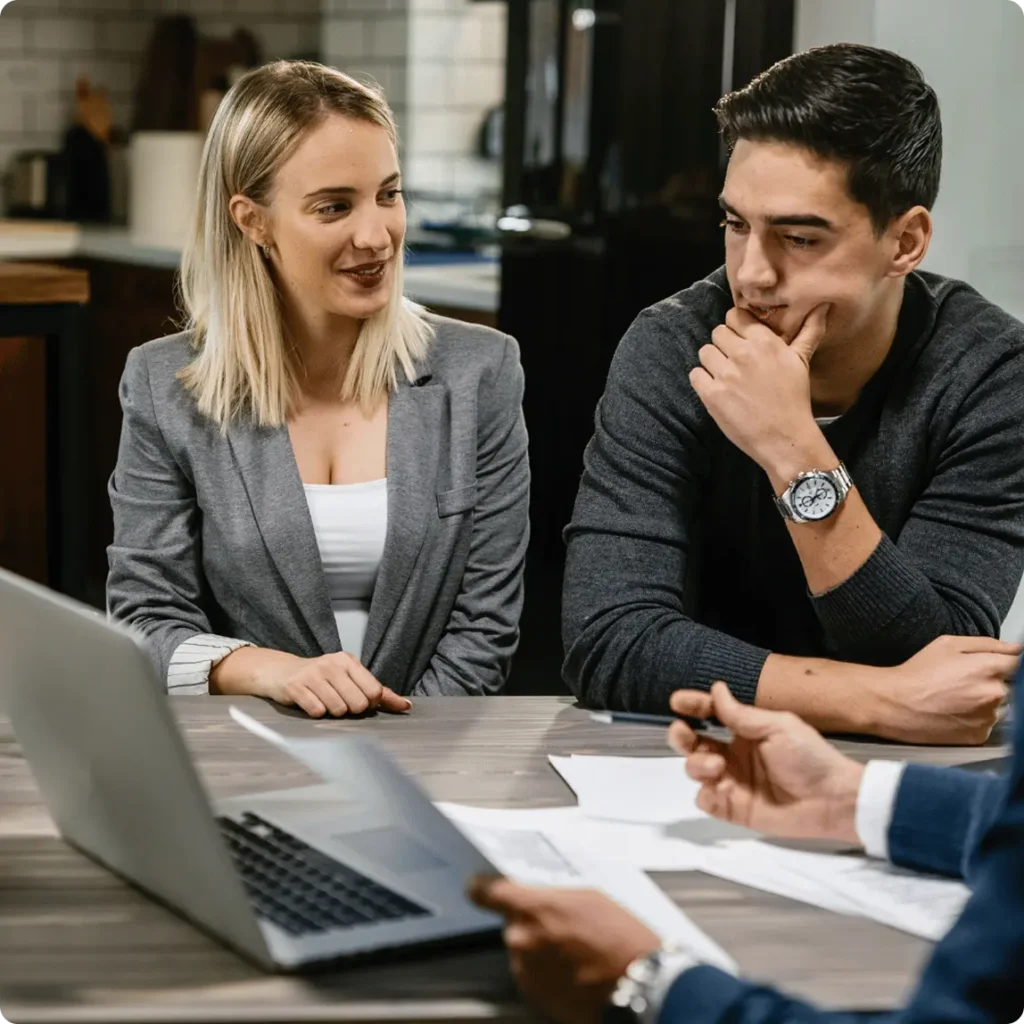 A man and woman sit at a table