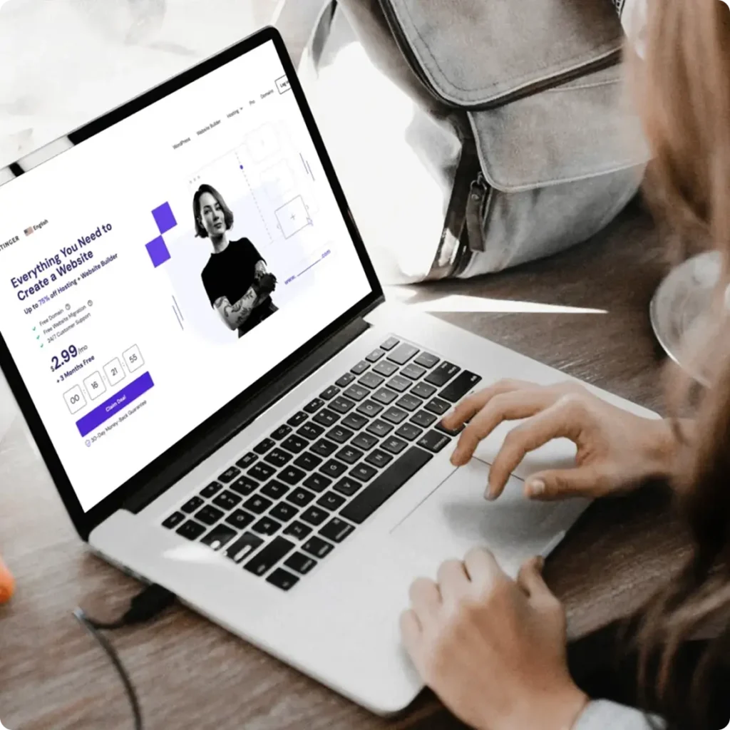 A woman typing on a laptop