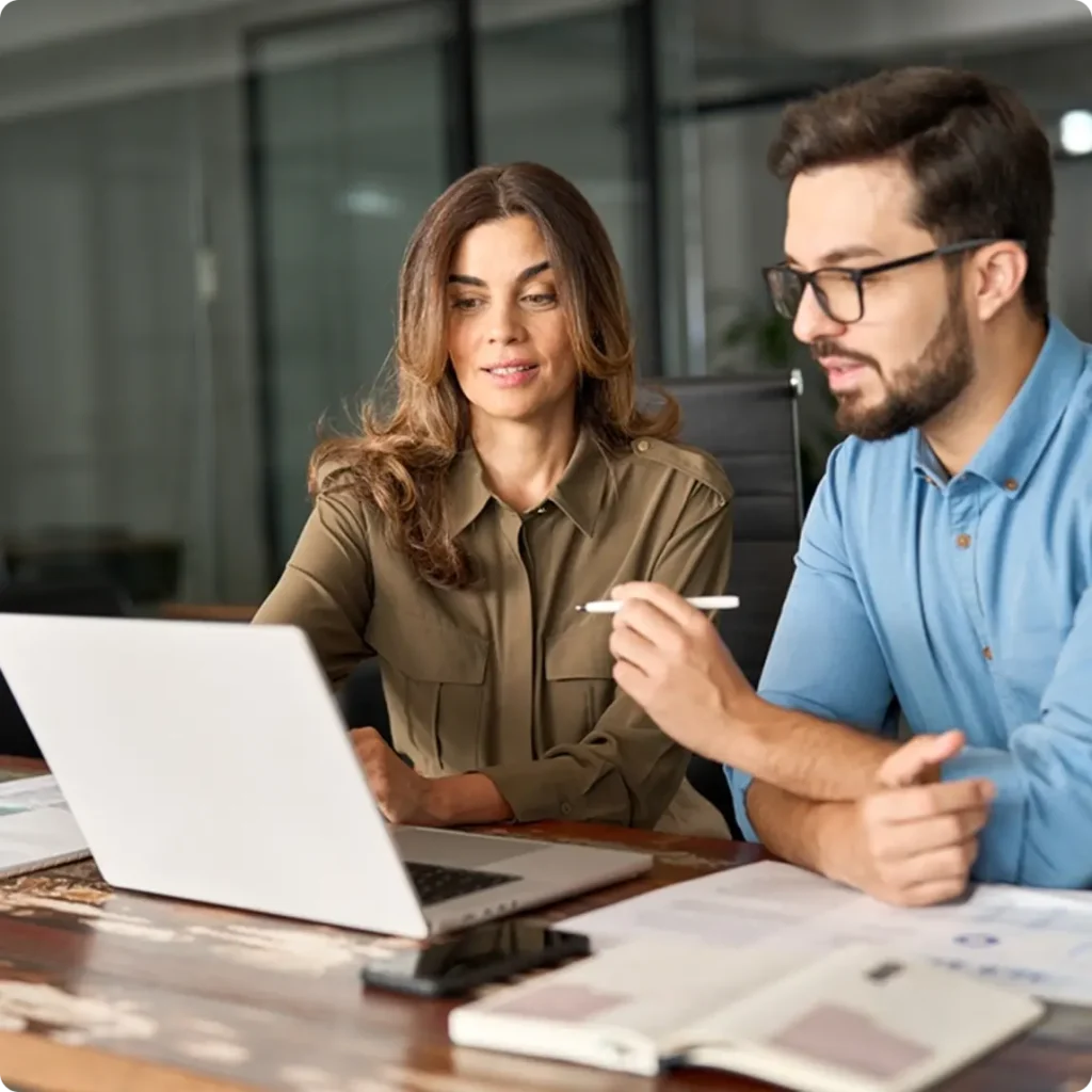 A man and woman sit at a table