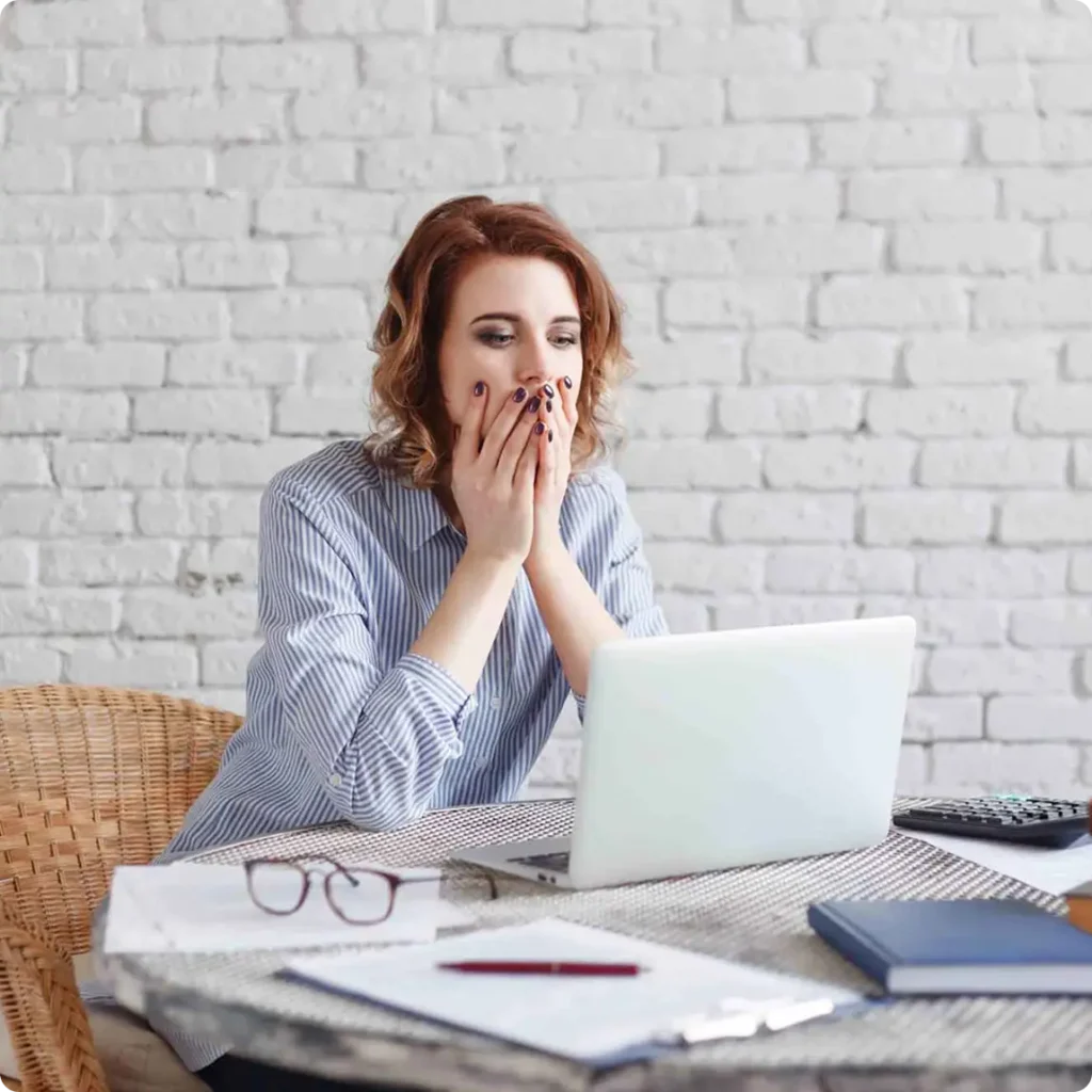 A woman is seated at a table