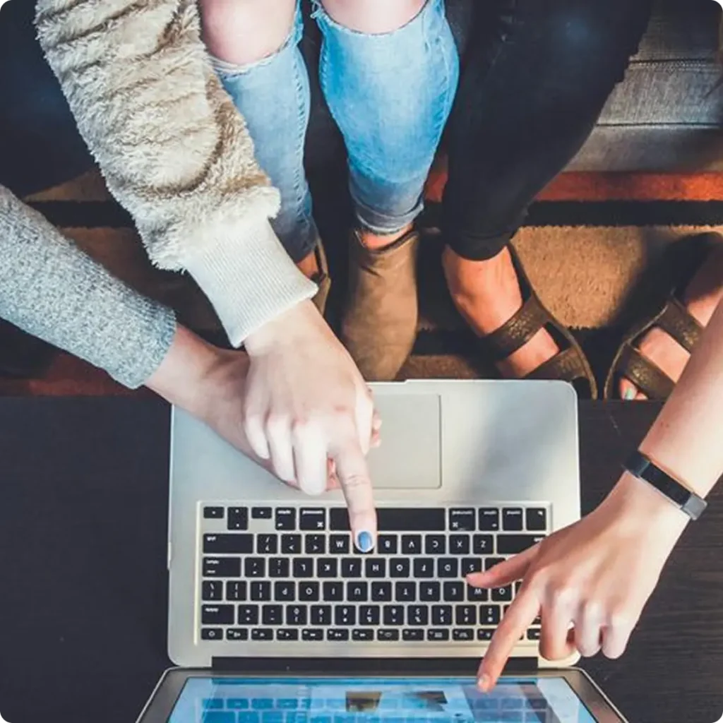 Four people sitting on a couch